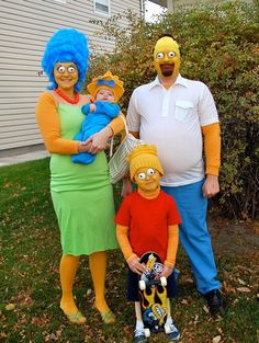 three adults and two children dressed up as the simpsons characters in front of a house