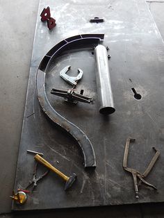 tools are laid out on top of a metal surface