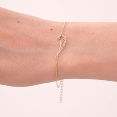 We got shiny protection for you and your loved ones. Ward off the bad energy around you with an elegant bracelet. You'll have- 14k solid gold handcrafted bracelet- 100% US sourced jewelry Size - Material: 14k Solid Gold & Diamond- Diamond carat: 0.01 ct (H Color, SI clarity)- Charm height: 6 mm- Charm width: 17 mm- Chain Style: Cable Chain You’ll get a certificate of authenticity with each piece. And your bracelet will pass multiple checkpoints to make sure you have your favorite piece. 14k Soli Angel Wings Bracelet, Diamond Angel, Angel Wing Bracelet, Angel Bracelet, Gold Angel Wings, Gold Angel, Bracelets Gold Diamond, Gold Bracelet For Women, Handcrafted Bracelets