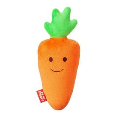 a stuffed carrot with a green leaf on top of it's head and eyes