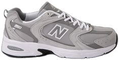 a pair of new balance shoes with white and grey uppersoles on the sole