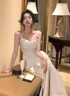 Elegant Sleeveless Slip Dress For Banquet, Elegant White Suspender Dress For Night Out, Chic Wedding Suspender Dress With Spaghetti Straps, Elegant Suspender Dress For Prom Season Party, Elegant Suspender Dress For Party And Prom Season, Elegant Sleeveless Suspender Wedding Dress, White Strapless Slip Dress For Party, Elegant Spaghetti Strap Dress For Banquet, Elegant Spring Wedding Suspender Dress