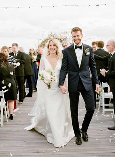 a newly married couple walking down the aisle