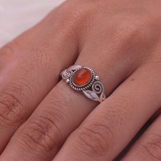 "Carnelian Ring / 925 Solid Sterling Silver Ring / July Birthstone Ring / Halloween Jewelry / Women Silver Ring / Christmas Gift. Gemstone Name - Carnelian. Stone Quality - AAA Ring Weight -2.15 gm Stone  Length - 0.6 cm Stone  Width  -  0.4cm Stone Shape - As shown in the picture. Ring Size - All Ring Size Available You'll get the exact product as shown in the pictures We serve complete 925 sterling silver Jewelry and genuine properties of the stone. The products are dispatched from the small business from USA. Product Quality and Packaging - Our all products are 925 Silver Stamped which shows that the product is genuine and authentic .The products are dispatched from the small business from USA so you get the product on time and the product packaging comes in bubble foil wrap with all th Silver Carnelian Ring Stamped 925, Sterling Silver Gemstone Ring In Orange, Silver Carnelian Ring As A Gift, Sterling Silver Orange Gemstone Rings, Silver Carnelian Rings Spiritual Style, Sterling Silver Rings With Orange Gemstone, Silver Carnelian Rings For Gift, Orange Gemstone Ring In Sterling Silver, Orange Sterling Silver Ring