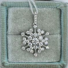 Diamond Snowflake Pendant set with beautiful clear and sparkling diamonds.  The diamonds shimmers on this piece.  Excellent craftsmanship, lays nicely on the neck won't flip around.  Give the gift of good luck with this pretty necklace. The diamonds are clean and of good quality; this is one she will treasure for a lifetime.  Measures from top of bail down about 23.5 length x 14.9mm width.  Available strong 14K white gold link chain for purchase.  Good quality diamonds, no black carbon spot even when viewed under a magnifying glass.   Genuine Round Brilliant Cut Diamonds  Total weight: 1.12 carats  Clarity: SI1 Color: F/G 18K White gold 1.57 grams  Comes with gift box JA9160x.eg * We have been in the wholesale Jewelry business for over 30 years serving the community at the same location. Dazzling Sparkling Diamond Necklace, Diamond White Snowflake Jewelry For Anniversary, Diamond White Cubic Zirconia Snowflake Jewelry, White Snowflake Fine Jewelry, Sparkling Platinum Fine Jewelry, Snowflake Cubic Zirconia Jewelry For Anniversary, Fine Jewelry Snowflake Cubic Zirconia, Elegant Snowflake Shaped Cubic Zirconia Jewelry, Cubic Zirconia Snowflake Jewelry For Anniversary