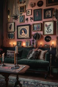 a living room filled with lots of pictures on the wall and candles in front of it