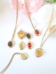 Very unique pieces! Cute unused 70s vintage lockets for 2 photos, decorated with different original vintage crystals. These are all from New Old Stock and also are the decorative crystals in them, which as being vintage are limited and not produced nowadays. OVAL has 2 rings inside for holding pictures, and HEART has just 1. They are small (measurements below) and easy to wear, a lovely gift for a beloved one and any vintage lover! They are all available with chain or without. Hinges and closure Decorative Crystals, Vintage Gold Locket, Glass Locket Pendant, Oval Locket Necklace, Ladybug Necklace, North Star Necklace, Gold Heart Locket, Gold Locket Necklace, Memorial Pendant