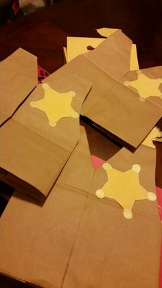 some brown paper bags with yellow stars on them