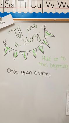 a white board with writing on it in front of a sign that says tell me story