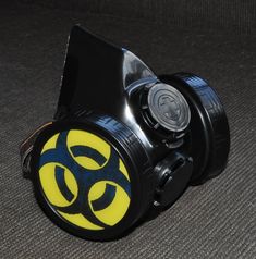 Black Cyber Mask made from PVC and plastic .   Gas Mask has inserts in the shape of a Yellow Sign Biohazard , Inserts a removable easy  D = 2.76 inch. (70 mm)  .   Cyber Goth Mask adult sized. An adjustable elastic band long and strong for easy fit and comfort on anyone. You can choose additional other biohazard , radiation , skull symbols by adding it from my other listing : https://www.etsy.com/listing/1741175014/biohazard-simbol-biohazard-inserts-cyber?click_key=2f9ef91c13e1e2540e1d76a4f61d7aeff83446ba%3A1741175014&click_sum=7b7078f8&ref=shop_home_active_2  Modified for easy breathing. All modification are made by hand ! Hi quality, by ZHOS ! Item new without tags. Good for fashion , festivals, parties, cyber gothic look, like gift . Shipping: We ship within 1-2 business days after clea Black Mask Costume Accessories For Themed Events, Black Mask For Themed Events, Black Sci-fi Cosplay Costume For Halloween, Sci-fi Black Cosplay Costume For Halloween, Plastic Halloween Cosplay Costume Accessories, Black Rave Mask For Cosplay, Plastic Costume Accessories For Cosplay Halloween, Plastic Costume Accessories For Halloween Cosplay, Black Fandom Cosplay Costume