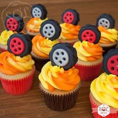 cupcakes decorated with buttons and orange frosting