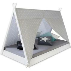 a bed with a white and gray tent on top of it's headboard