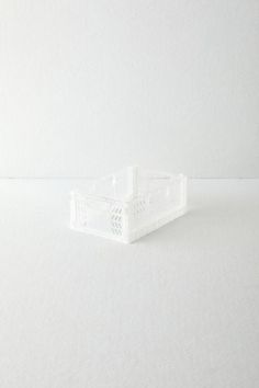 a plastic container sitting on top of a white table