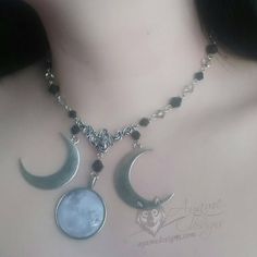 Introducing the Amaris necklace! This piece features a full moon cabochon pendant with large crescent moon pendants on either side with black and grey glass beads all around. It comes with an adjustable chain at the back so you can wear it whichever length you prefer. The necklace is 37.5-42.5cm in length - if you need me to make it longer or shorter, just add a note with the length you want it! All metal findings except the charms are stainless steel. All the charms are coated with Everbrite co Crescent Moon Pendant, Cabochon Pendant, Grey Glass, Beaded Choker Necklace, Moon Pendant, Beaded Choker, Crescent Moon, Full Moon, Crystal Beads