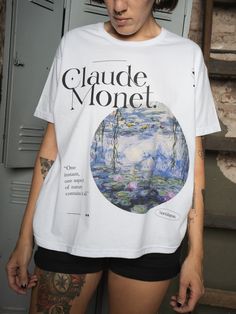 a woman wearing a t - shirt with the words glaude monet on it