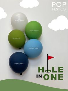 four balloons with the words hole in one written on them and an image of a golf flag