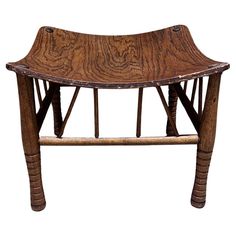 an old wooden bench with bent legs and wood grain on the seat, isolated against a white background