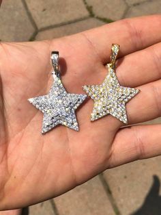 "Custom made super iced out STAR PENDANT. Made from 100% Solid 925 Sterling silver and finished in your choice of either Rhodium or 14k yellow gold. Adorned with 200 micro paved simulated diamonds (CZ) to give this piece an amazing super icy look! Measures approximately 1.25\" x 1.25\" and weighs approximately 8 grams. You can buy pendant only or with choice of 18-30\" 2.5mm diamond cut ball moon chains IF YOU WANT PENDANT ONLY, SELECT \"0\" Chains are also solid sterling silver and come with a Sparkling Star-shaped White Gold Jewelry, Dazzling Silver Star Jewelry, Sparkling Silver Star-shaped Jewelry, Sparkling Silver Star Jewelry, Sparkling Silver Starburst Jewelry, White Gold Pendant Necklace With Star Charm, Dazzling Star-shaped Jewelry Gift, Dazzling Star-shaped Jewelry For Gifts, White Round Jewelry With Star Charm