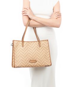 A women's designer tote bag for sale online which is lightweight and durable, as well as chic! Woven raffia in a bold chevron pattern is framed with rich calf leather. The boxy, elongated shape sits handsomely on your shoulder, closing securely with a top zipper. The advantage of this east-west silhouette is that it is sufficiently large to hold quite a lot without dwarfing gals of petite stature. An outer pocket on reverse is for easy access to phone or glasses. Inside: durable canvas lining an Luxury Double Handle Straw Bag, Designer Straw Bag With Top Carry Handle, Designer Straw Bag For Daily Use, Elegant Straw Bag For Errands, Straw Bag With Braided Handles For Errands, Modern Straw Bag For Errands, Modern Straw Bag With Top Carry Handle, Elegant Rectangular Straw Bag For Errands, Chic Straw Bag For Errands