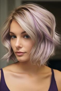 Soft violet shades like delicate lilac are always a top choice for adding a charming and dreamy vibe to your hair without going overboard. This gentle contrast brings a romantic warmth and whimsy to your ash blond hair, which also gives it a gentle definition. Click here to check out more trending ash blonde hair color ideas you need to try. Color Hair Highlights Blonde, Subtle Pops Of Color In Blonde Hair, Short Blonde Hair With Purple Highlights, Boho Hair Color Ideas, Blonde And Purple Hair Short, Lilac Highlights Blonde, Lilac Blonde Hair, Blonde And Lilac Hair, Lavender Blonde Hair