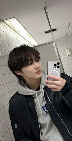 a person taking a selfie in a bathroom