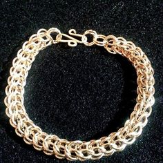 Handmade/Wire Wrapped 14k GF Full Persian Chainmaille Bracelet with hammered hook clasp. Very comfortable can be worn as an everyday bracelet. Very Sturdy and heavy link bracelet. Gold Handmade Chain Link Bracelet, Classic Handmade Gold Sterling Silver Bracelet, Classic Gold Sterling Silver Handmade Bracelet, Handmade Gold Link Bracelets, Handmade Gold Sterling Silver Bracelet, Handmade Round Gold Sterling Silver Bracelet, Elegant Chainmail Bracelets As Gift, Elegant Chainmail Bracelet For Gift, Elegant Chainmail Bracelets For Gift