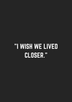 the words i wish we lived closed are written in white ink on a black background