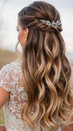 a woman with long hair wearing a wedding dress