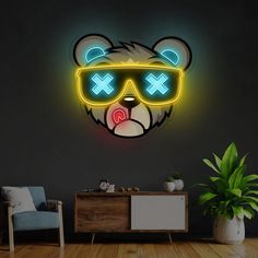 a teddy bear wearing sunglasses with neon lights