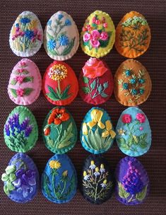 an assortment of decorated eggs sitting on top of a table