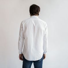 The White Oxford shirt is one of the most timeless and versatile pieces in the service industry, able to be dressed up with a blazer, or down with jeans and sneakers. The updated and upgraded version of our Service Oxford features an equally durable but much softer 75/25 cotton poly blend, as well as cleaner stitching, a crisper collar, and an improved fit. Features: Button-down collar, clean finished seams Material: 75% Cotton, 25% Polyester, 4oz White Oxford Cloth Fit: Model is 6'0"/170 lbs, w Fitted Cotton Dress Shirt For Everyday, Business Cotton Shirt With Relaxed Fit, Fitted Long Sleeve Dress Shirt For Everyday, Relaxed Fit Cotton Business Shirt, Relaxed Fit Cotton Shirt For Business, Modern Cotton Business Shirt, Casual Fitted Dress Shirt For Everyday, Tailored Cotton Business Shirt, Tailored Cotton Shirt For Business