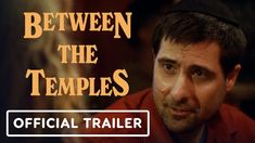 the trailer for between the temples features an image of a man in a red jacket