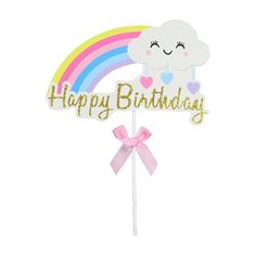 a happy birthday cake topper with a rainbow and clouds on it, in gold glitter