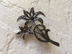 "Perfect for all bridal wedding wears!! Romantic flower shaped brooch pin embellished with black rhinestones crystals on top. Size: measures around 2.5\" long x 2.4\" width Color: dark silver with black rhinestone crystals Item ship out with tracking number to you (around 10 to 14 business days for delivery). We also provide fast shipping service, around 3-4 business days delivery but need to add extra charge. Please convo us if need." Vintage Black Brooch For Anniversary, Black Wedding Brooches With Handmade Flowers, Vintage Crystal Brooches For Anniversary, Dangly Necklace, Antique Black Evening Brooch, Brooch Dress, Evening Accessories, Crystal Jewelry Sets, Silver Flower-shaped Brooches With Rhinestones