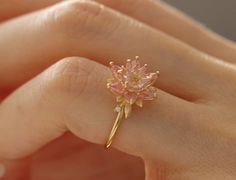 It is made in gold or silver according to finger sizes and optionally as special handwork. Flower Ring Aesthetic, Wedding Ring Delicate, Lotus Ring Engagement, Delicate Pink Flower Ring For Wedding, Handmade Pink Ring In Fine Jewelry Style, Handmade Pink Rings In Fine Jewelry Style, Handmade Pink Fine Jewelry Ring, Dainty Pink Flower Ring For Weddings, Pink Flower Promise Ring In Fine Jewelry Style