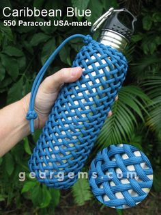 a person is holding a blue bottle in front of some plants and trees with the caption, caribbean blue 350 paracord usa - made