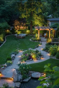 an outdoor garden with lights and landscaping