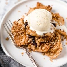 a close up of a plate of food with fruit and ice cream on the top