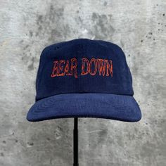 Bear Down Embroidered Hat. 100% cotton corduroy Soft, unstructured crown with a cotton twill sweatband and taping. Adjustable buckle. This product is made especially for you as soon as you place an order, which is why it takes us a bit longer to deliver it to you. Making products on demand instead of in bulk helps reduce overproduction, so thank you for making thoughtful purchasing decisions! Vintage Cotton Baseball Cap For Winter, Winter Adjustable Snapback Hat For Streetwear, Adjustable Snapback Hat For Winter Streetwear, Winter Cotton Snapback Hat With Curved Brim, Winter Cotton Snapback Hat With Flat Brim, Adjustable Cotton Baseball Cap For Winter, Adjustable Corduroy Snapback Hat, Adjustable Corduroy Snapback Cap, Adjustable Cotton Hat For Streetwear