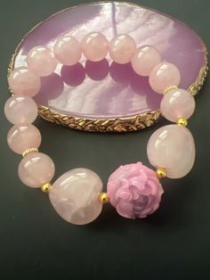 Item Details:  Unique Custom Made Natural Rose Quartz Crystal Beads and Hearts w/ FengShui Peony Flower Charm Elastic Bracelet Symbolizes Good Fortune Rose Quartz is known as a healing crystal and a stone of unconditional love that carries a soft, feminine energy. It opens and cleanses the heart chakra, allowing vibrations of love to flow freely and without fear. It promotes healthy and harmonious relationships of all kind, and can be effective for attracting new love. It raises one's self-estee Soft Feminine, Rose Quartz Beads, Elastic Bracelet, Rose Quartz Crystal, Peony Flower, Good Fortune, Feminine Energy, Flower Charm, Heart Chakra