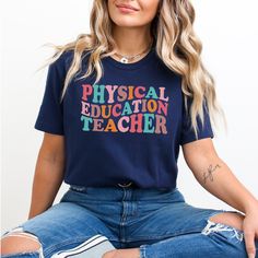 Whether you're looking for a fun and unique gift for a teacher friend or want to treat yourself to something special for the first day of school, this PE Teacher shirt is sure to bring a smile to your face and to your students'. Find more back to school shirts, sweatshirts and gifts for your favorite Physical Education Teacher here: https://www.etsy.com/shop/JaxGraphicTees?search_query=pe All of our adult t-shirts are Bella + Canvas 3001 Unisex shirts. They are a super soft fabric that will quic School Spirit Cotton T-shirt As Gift, School Spirit Letter Print Top, School Spirit T-shirt With Letter Print As Gift, Funny Cotton T-shirt For Teaching, School Spirit Tops With Funny Print For Teacher Appreciation, Funny T-shirt For Teacher Appreciation And Back To School, Casual T-shirt For Back To School Gift, Back To School Graphic Print Top, End Of School Year Gift T-shirt