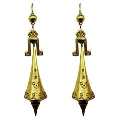 These beautiful 14k Etruscan Revival Gold Drop Earrings are a testament to Victorian jewelry design. In good condition, they feature a classic yellow gold metal that adds elegance and sophistication to any outfit. With a length of 2.5 inches and a weight of 4.7 grams, they are the perfect statement piece for any occasion. 14k Etruscan Revival Gold Drop Earrings Condition: In good condition with some minor surface wear consistent with age. Period: Victorian Length: 2.5 inches Metal: 14k Yellow Go Etruscan Jewelry, Victorian Jewelry, Gold Drop Earrings, Statement Pieces, Gold Metal, Metallica, Etsy Earrings, Jewelry Design, Jewelry Earrings