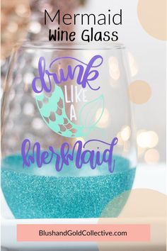 a mermaid wine glass with the words drink like a mermaid in purple and teal