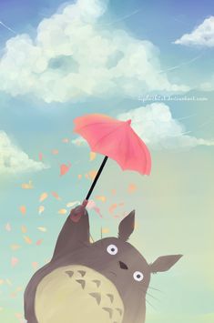 a totoro holding an umbrella in the air