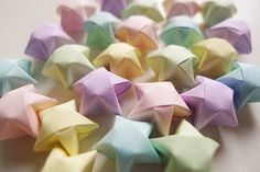 small origami stars are arranged on a table