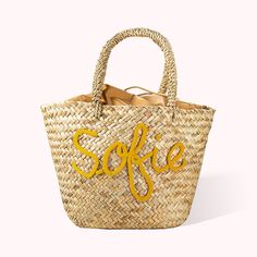 a straw bag with the word sofie painted on it's front and side