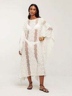 Introducing our Coumba Dress in Bijour Blanc, a stunning addition to your resort wardrobe. Crafted from 100% cotton eyelet with floral appliqué, this flowy caftan-style dress boasts a versatile midi length and can be effortlessly styled as a beach cover-up or paired with a slip dress for a chic daytime look. Flowy caftan Midi length Not lined Can be worn as a beach cover-up with a swimsuit or with a slip dress underneath. 100% cotton SIZINGSizes XS/S to 3XLCAREMachine wash cold with similar colo White Bohemian Dress For Resort Season, Bohemian White Dress For Resort Season, White Lace Beach Dress For Vacation, White Lace Dresses For Beach Season, White Beachwear Maxi Dress For Resort Season, White Lace Beach Cover-up Dress, White Lace Beach Dress For Cover-up, White Lace Beach Dress Cover-up, White Lace Maxi Dress For Beach Season