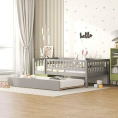 a baby's room with a crib, bookcase and toys on the floor