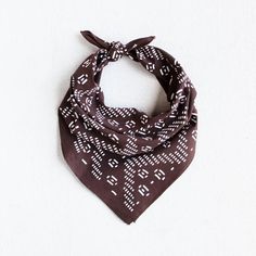 a brown and white bandana on a white background