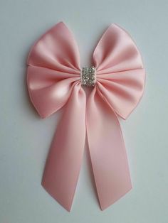 8 cm Wide Satin Bows With Tails Colour - Baby pink/silver glitter trim Choose Feature and quantity you like from drop down list Measures about 8 cm wide , tails about 9 cm, length in total about 13 cm  Made of 38 and 25 mm ribbon  Ideal for your craft projects, Gift box decorating,  wedding/party , hair clips, Boutique, accessories,  sewing and much more Decorating Wedding, Accessories Sewing, Pink Hair Bows, Christmas Tree Bows, Satin Ribbon Bow, Gift Wrapping Bows, Party Hair, Wedding Bows, Silver Bow